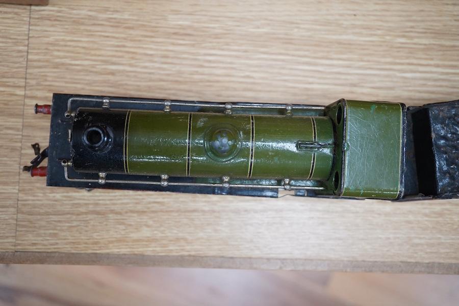 A Bing for Bassett Lowke 0 gauge tinplate clockwork LNER Ivatt 4-4-0 tender locomotive, 4390, together with an early Hornby clockwork 0-4-0, 2710, in GNR green livery with Meccano Ltd roundels to locomotive splasher and